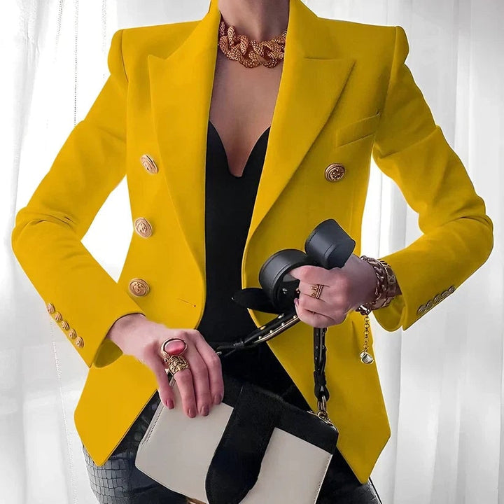 Close-up of gold cuff button detailing on the tailored long sleeve of the Monroe blazer