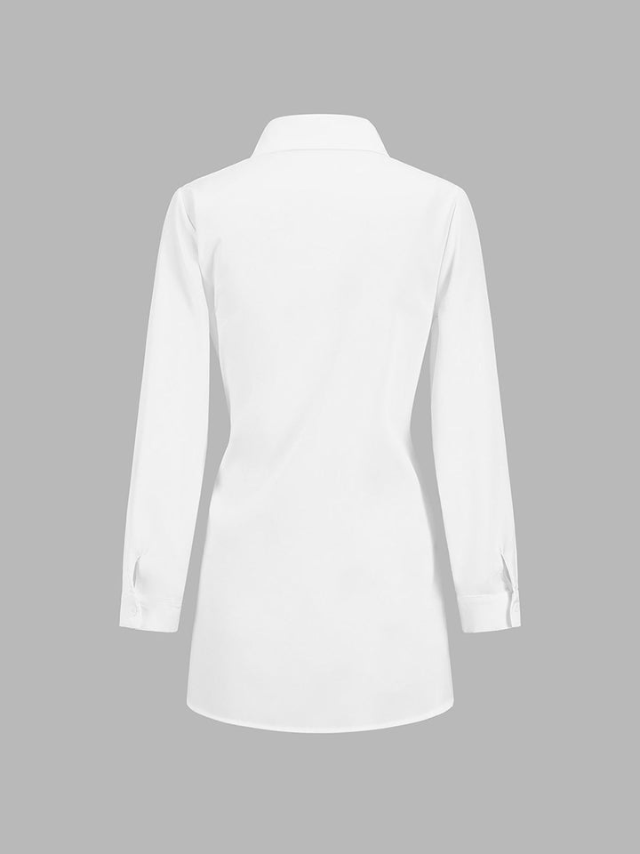 Side view of the Monroe blouse in black showing relaxed longline silhouette