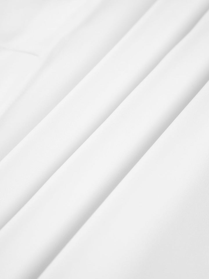 Flat lay of the Monroe tie waist blouse in white, black, and blue colorways