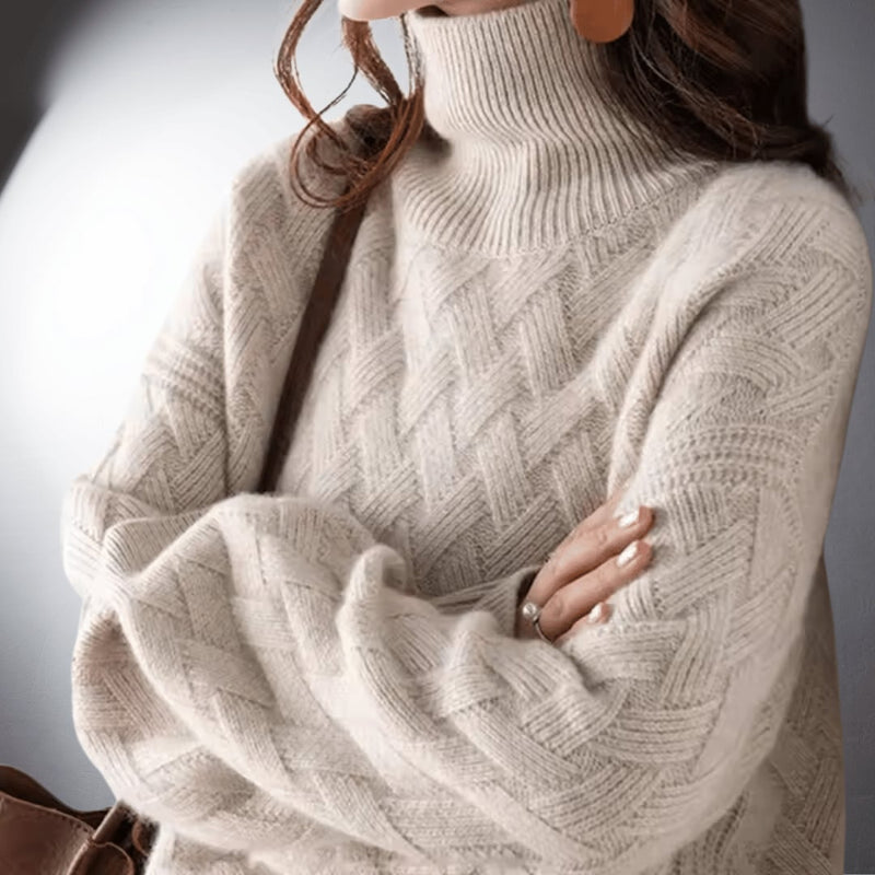 Woman wearing a light beige oversized cozy sweater with a relaxed, flowing fit