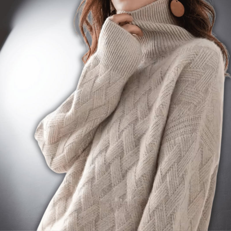 Close-up of an off white oversized sweater showing soft fabric texture and relaxed silhouette