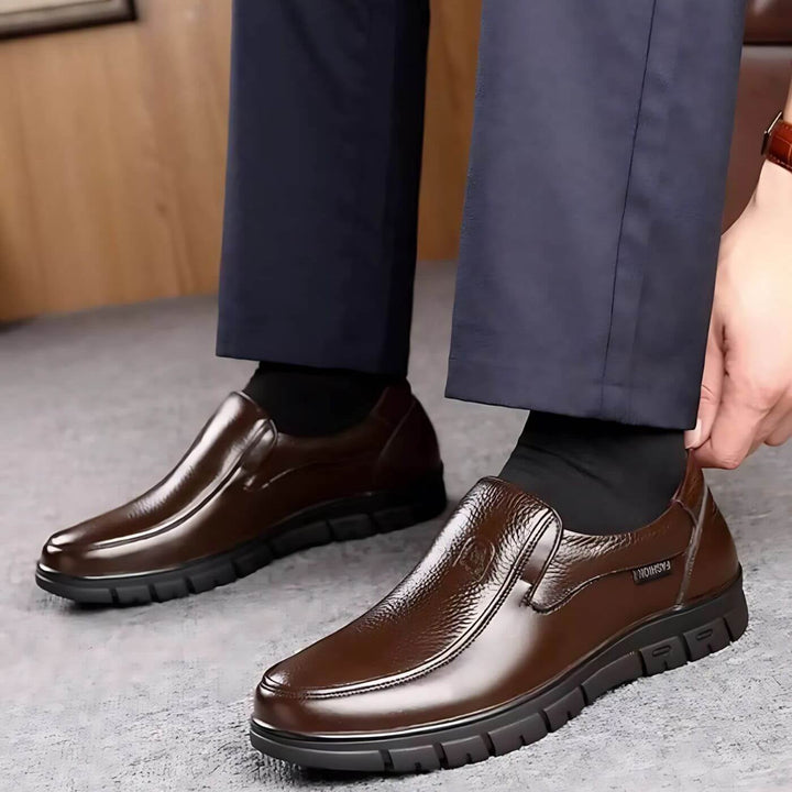 Side profile of Montford slip-on shoes in black showcasing the anti-slip sole and elegant design