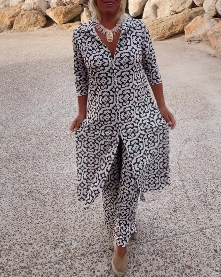 Woman wearing the Mosa fuchsia geometric print longline shirt and straight-leg pants two-piece set, front view