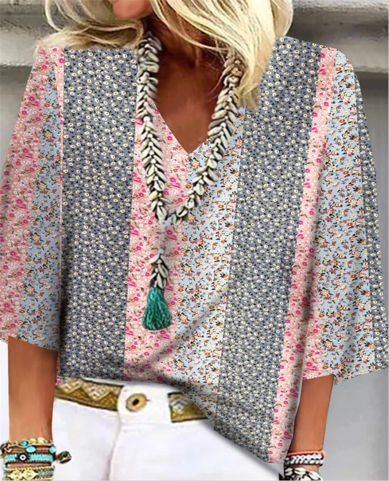 Woman wearing the Mosaic ditsy floral patchwork V-neck top in pink colorblock with 3/4 sleeves and relaxed fit