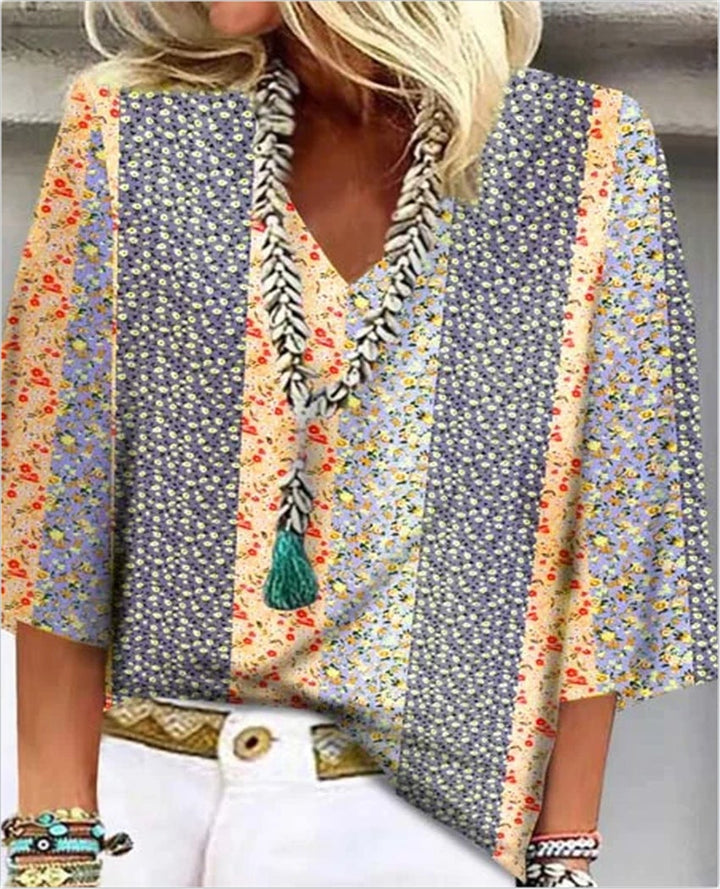 Side view of the Mosaic patchwork floral top highlighting the relaxed oversized silhouette and elbow-length sleeves