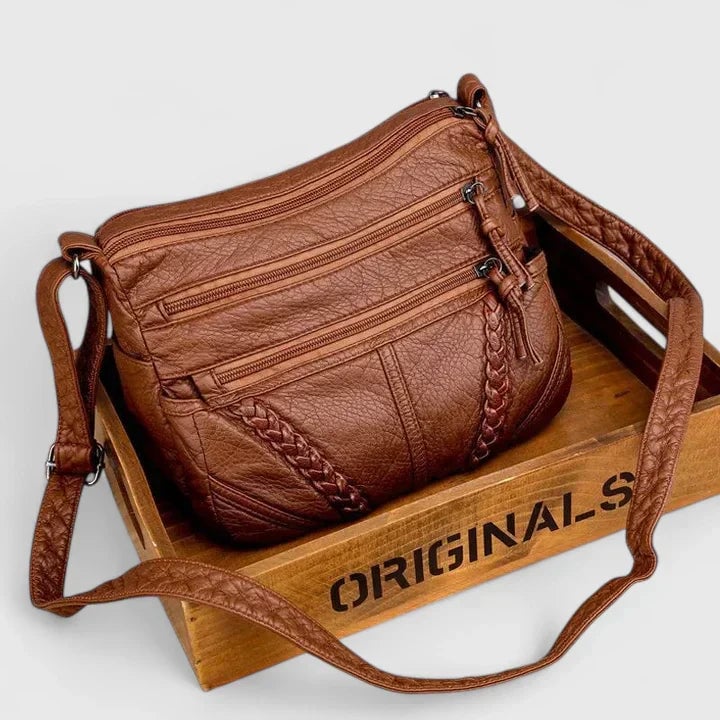 Front view of the Mykahlynn elegant structured handbag in brown with clean lines and a polished silhouette