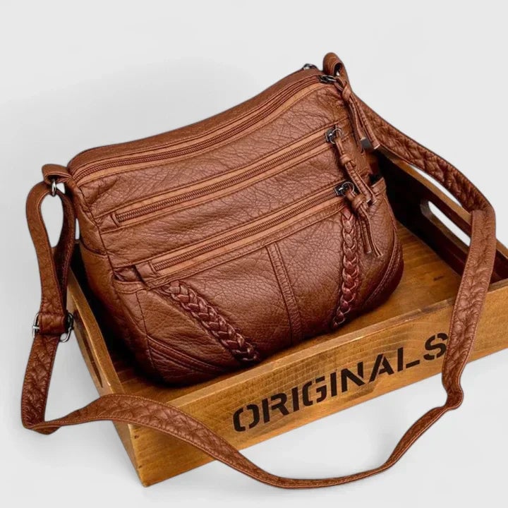 Brown version of the Mykahlynn elegant handbag displayed on a clean white surface