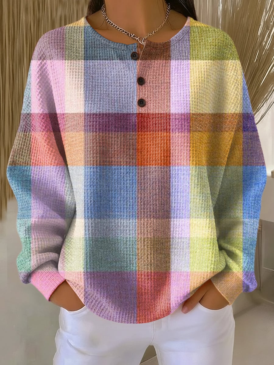Woman wearing the Nadia chic long sleeve sweater in multicolor, featuring a tailored silhouette and elegant long sleeves