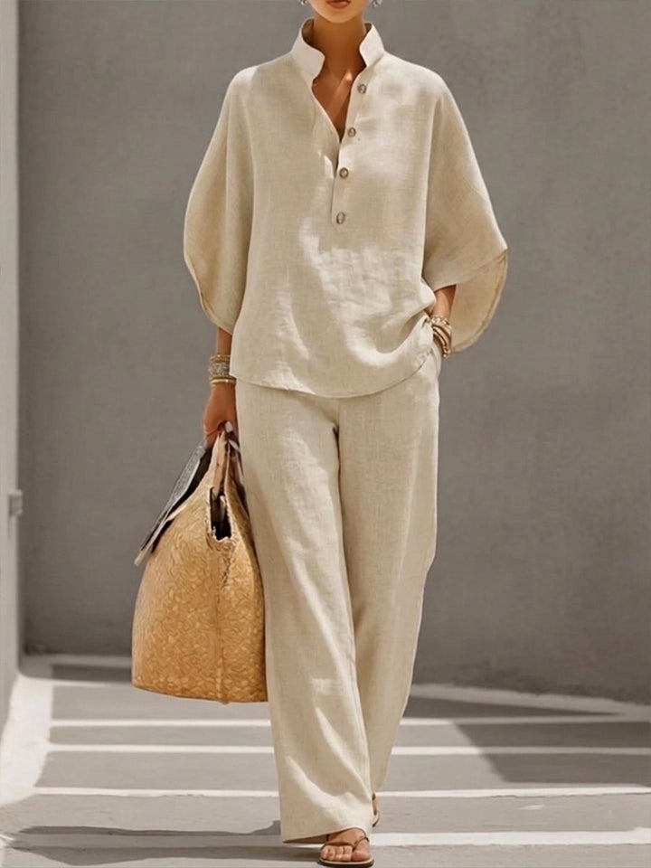 Woman wearing the Nadia beige batwing-sleeve top and wide-leg pants two-piece set, standing in natural light
