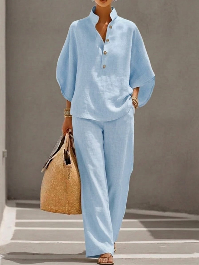 Front view of the Nadia light blue 2-piece set showing the button-placket neckline and flowing batwing sleeves