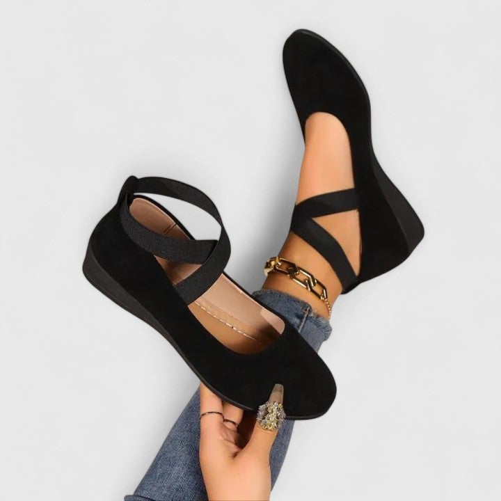 Nadia women's suede cross-strap wedge flats in black with elastic crisscross straps and low hidden wedge sole