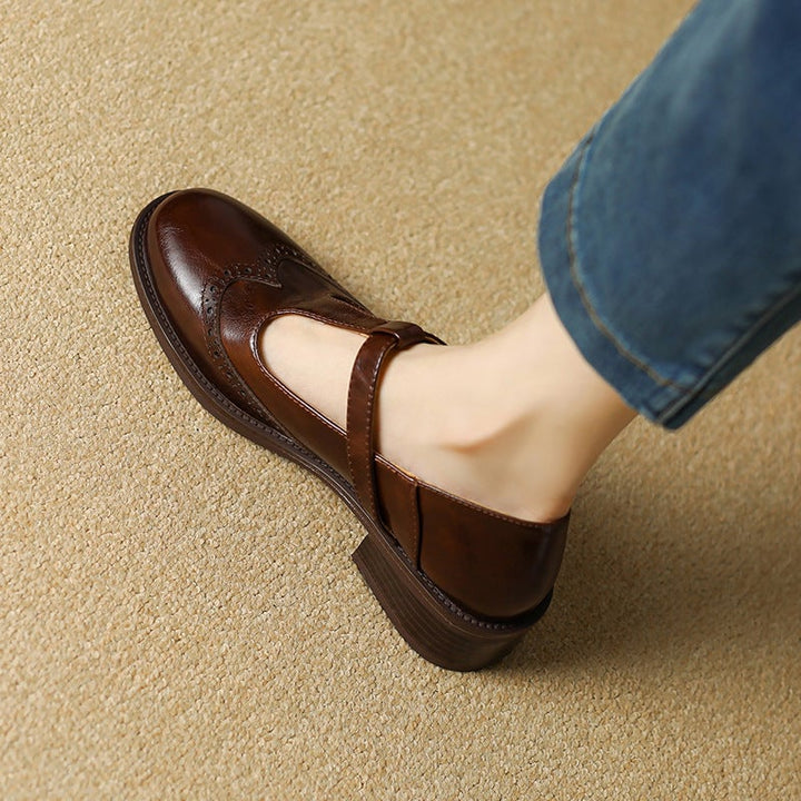 Nadine beige leather T-strap Mary Jane shoes, side profile showing gold-tone buckle closure