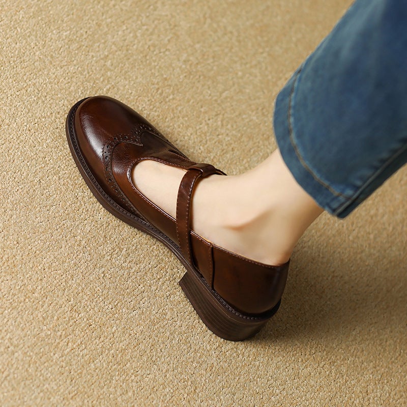 Nadine beige leather T-strap Mary Jane shoes, side profile showing gold-tone buckle closure