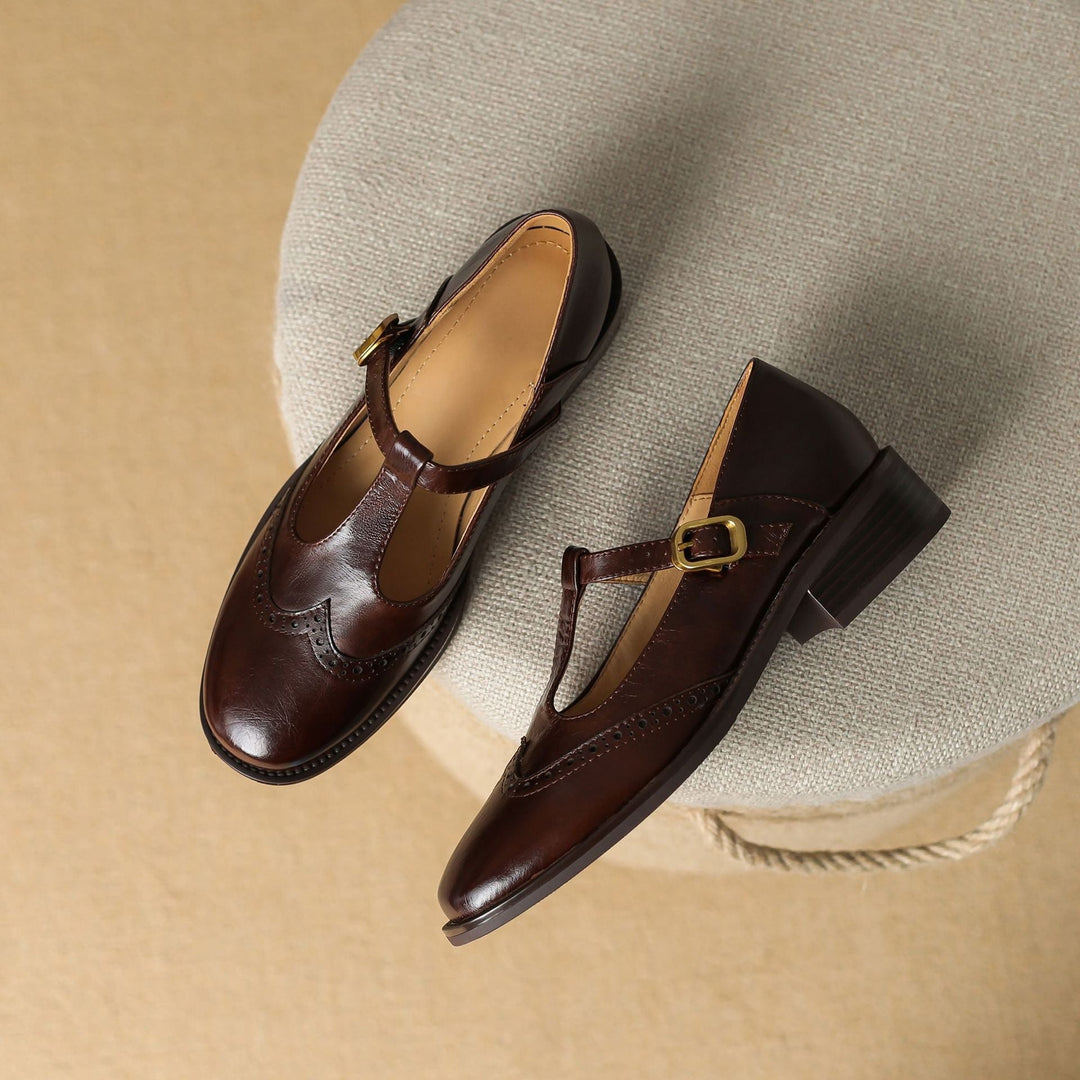 Nadine black leather Mary Jane shoes, close-up of brogue wingtip toe detail