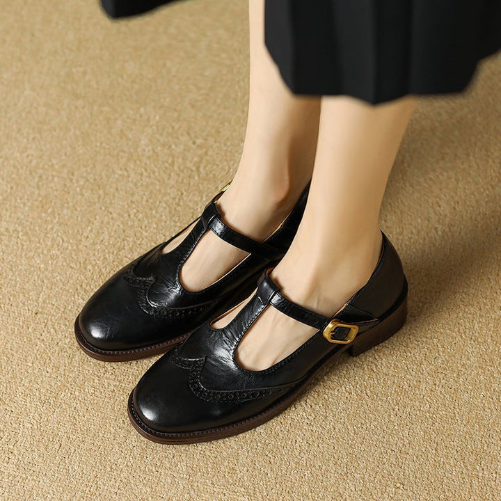 Nadine black T-strap Mary Jane shoes, sole and heel view