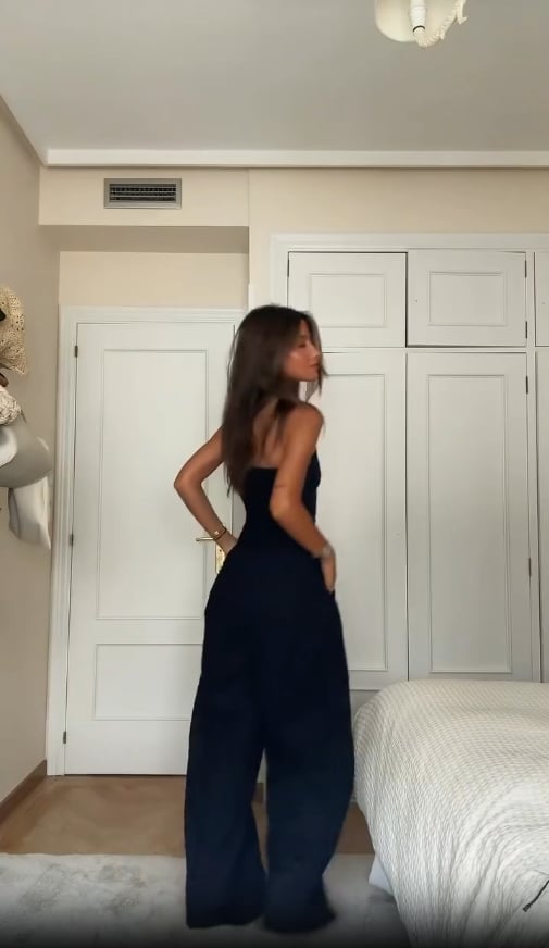 Front view of the Nancy jumpsuit showing its elongating silhouette and polished fit