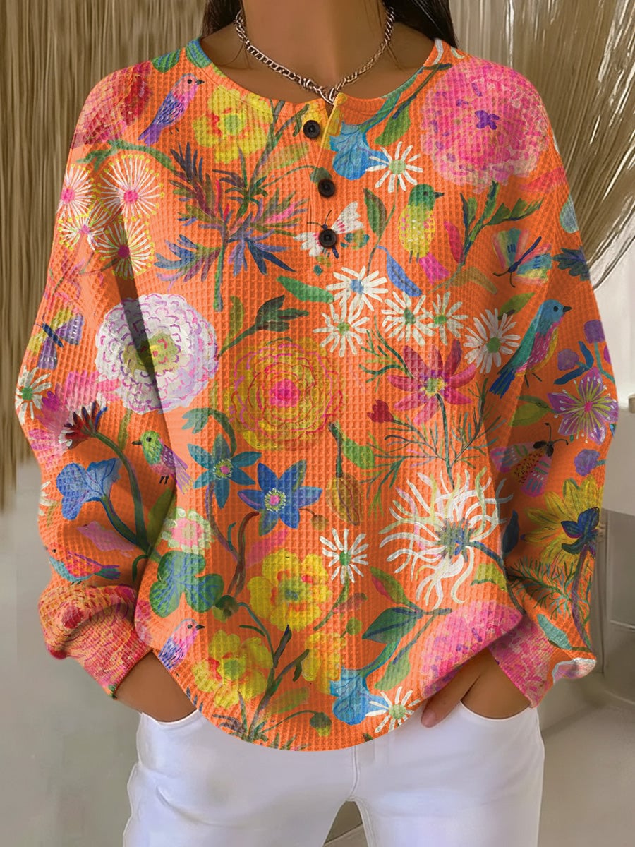 Woman wearing an orange classic pullover sweater with a relaxed, flattering fit from Florimay