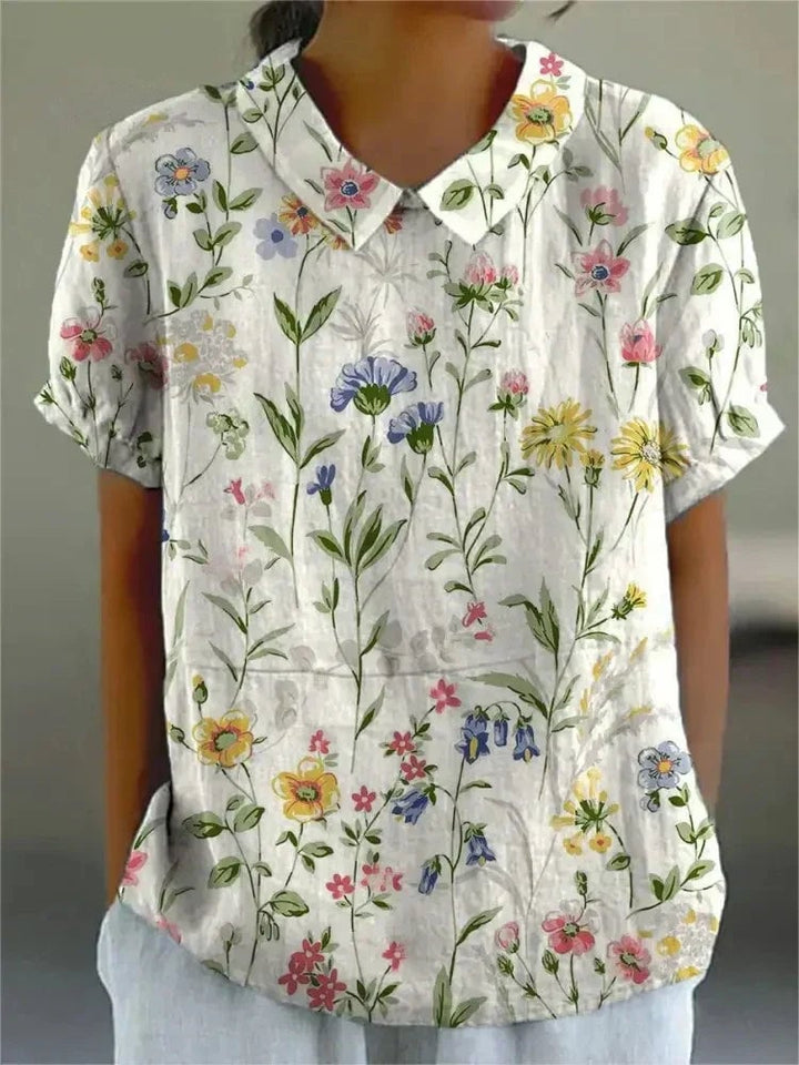 Close-up of the Nancy floral shirt showing delicate floral print fabric detail and lightweight material