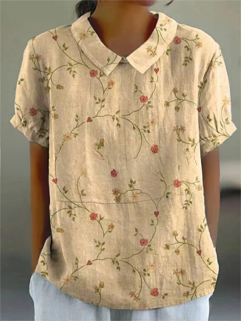 Flat lay of the Nancy floral shirt in green-yellow colorway highlighting the all-over floral pattern