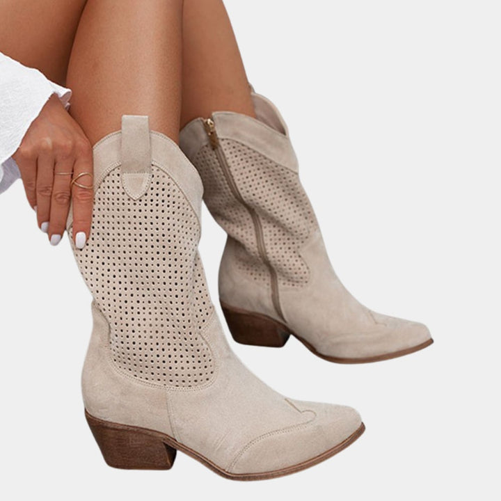 Woman wearing Natalie cowboy boots in beige styled with high-waisted jeans