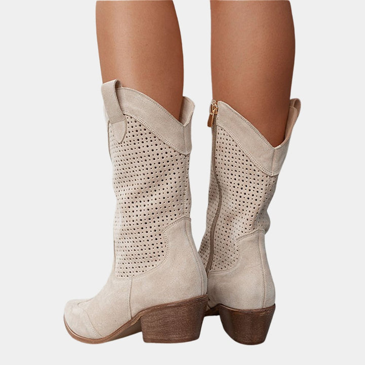 Overhead flat lay of all four color options of Natalie cowboy boots: white, beige, black, and brown