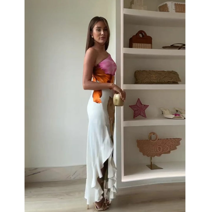 Full-length shot of a woman in the Natasha floral maxi dress styled for a formal occasion