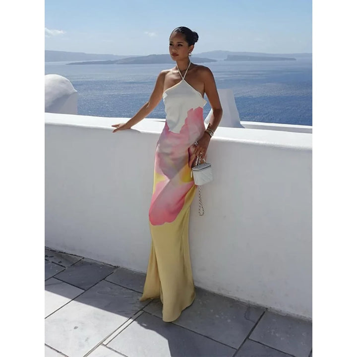 Detail shot of the one shoulder strap and floral pattern on the Natasha maxi dress in white