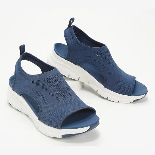Side profile view of the Nell women's sandal highlighting the supportive strap design