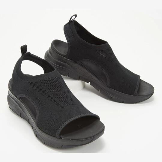 Nell sandals in dark brown styled on a flat surface to show color and texture