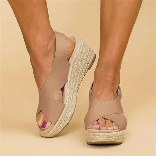 Woman wearing Neve orthopedic cushioned sandals in white with a summer dress, lifestyle shot