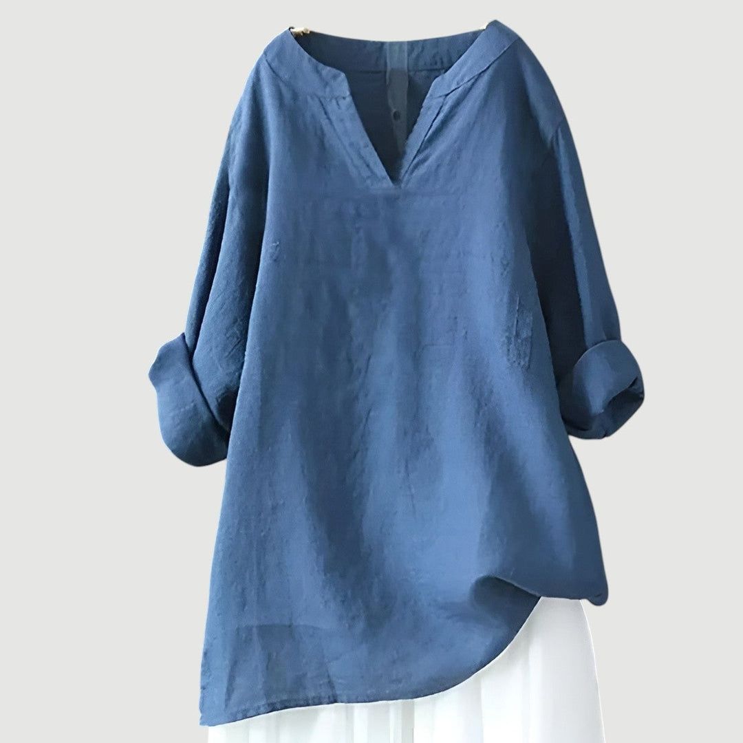 Woman wearing a lightweight flowy top in a relaxed silhouette, styled casually for warm weather