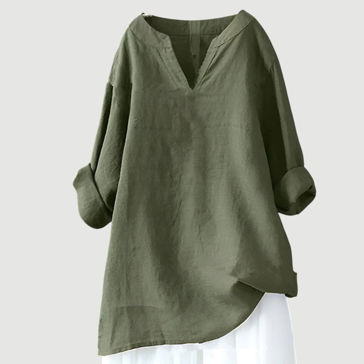 Close-up detail of the airy, breezy fabric and minimalist design of the flowy women's top