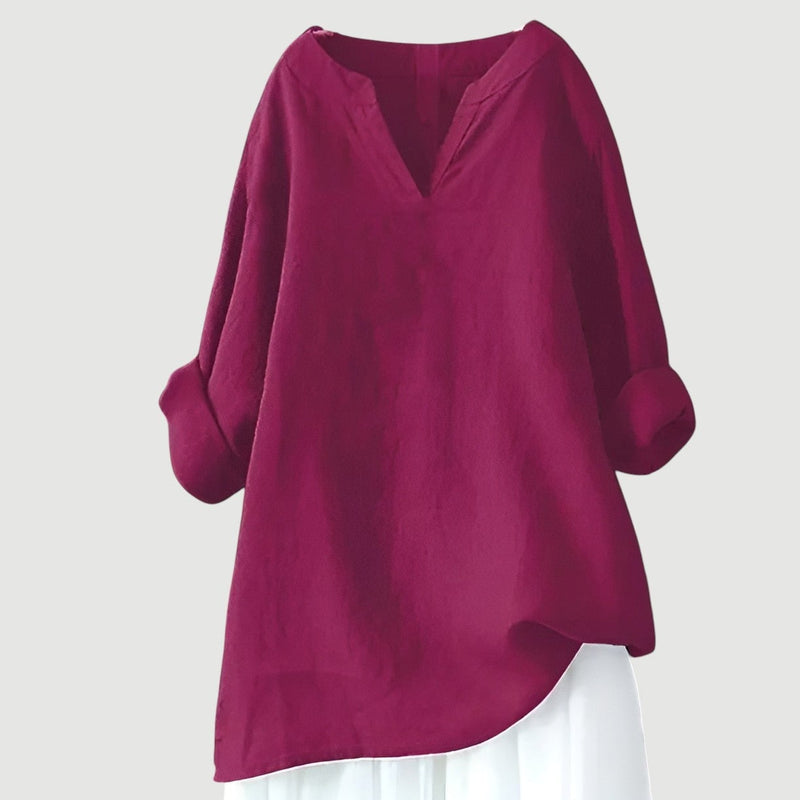 Woman in a flowy comfortable top paired with casual bottoms, perfect for everyday summer wear