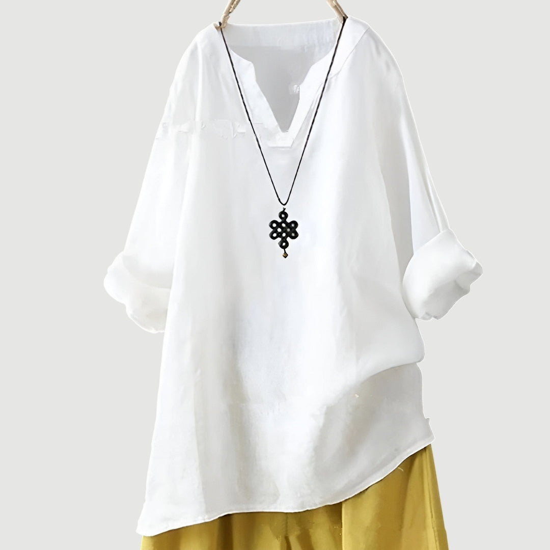 Woman wearing the airy top outdoors in a warm-weather setting, looking effortlessly stylish