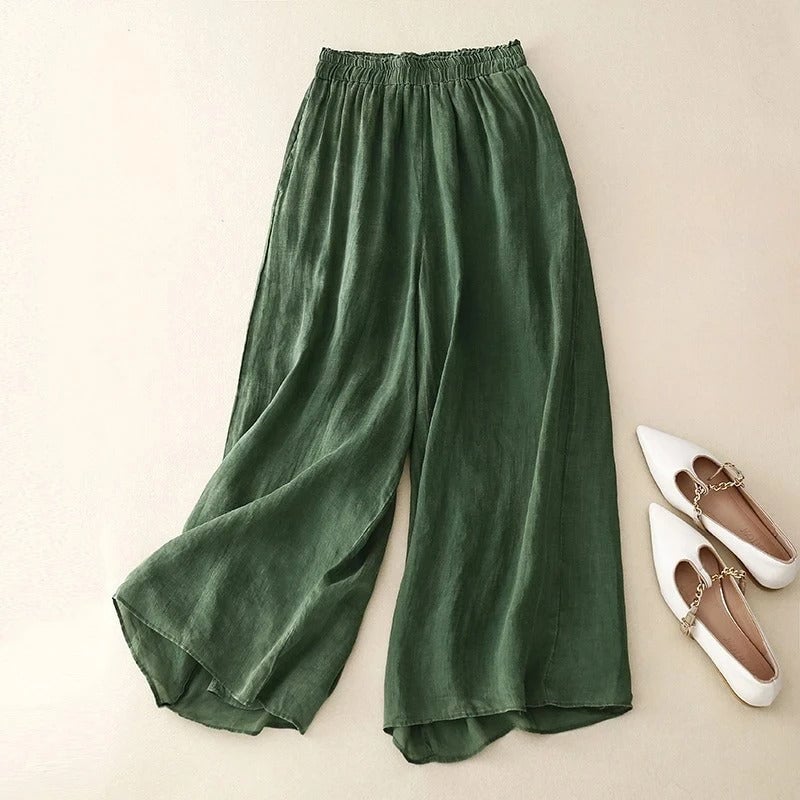 Close-up of the relaxed elastic waistband detail on lightweight flowing wide-leg pants
