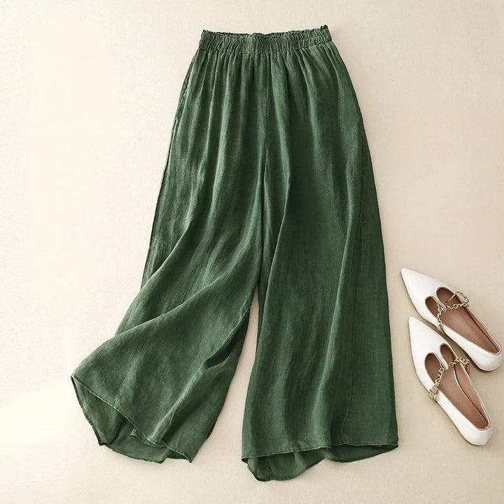 Close-up of the relaxed elastic waistband detail on lightweight flowing wide-leg pants