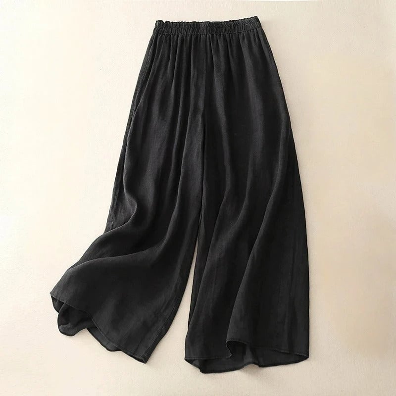 Flat lay of loose waistband pants showing fabric texture and clean straight-leg cut