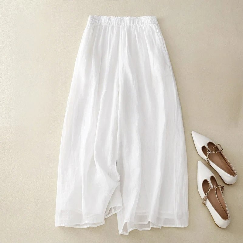 Woman styling wide-leg pants with a casual top, demonstrating versatile everyday wear