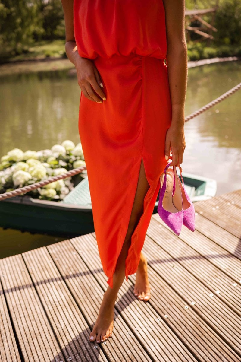 Full-length shot of the Nicole midi dress in yellow, showing the clean silhouette