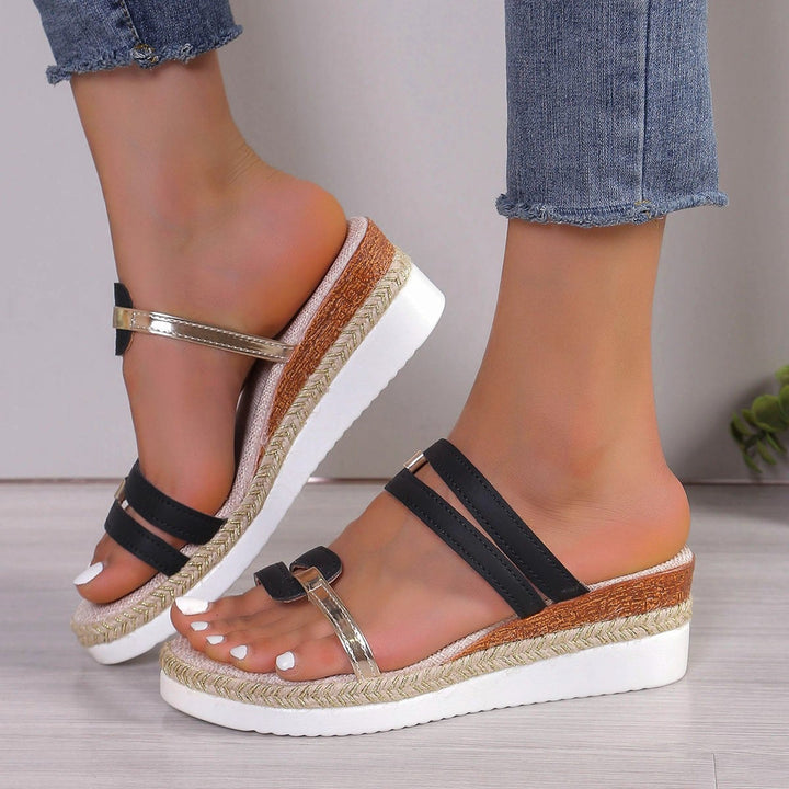 Close-up of Nicolette rhinestone platform sandals showing sparkling embellished straps and platform heel detail