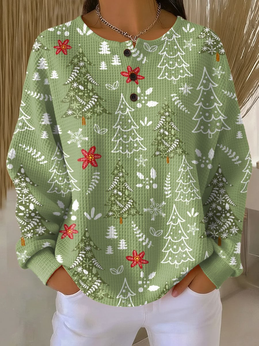 Woman wearing a soft green relaxed-fit pullover sweater with a flattering drape, styled casually for everyday wear