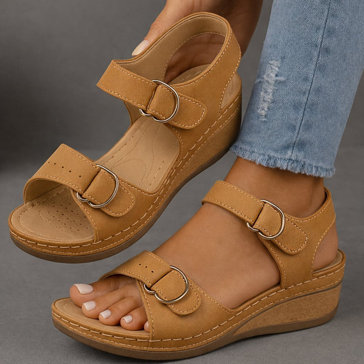 Pair of Nina wedge sandals displayed side by side showing color options