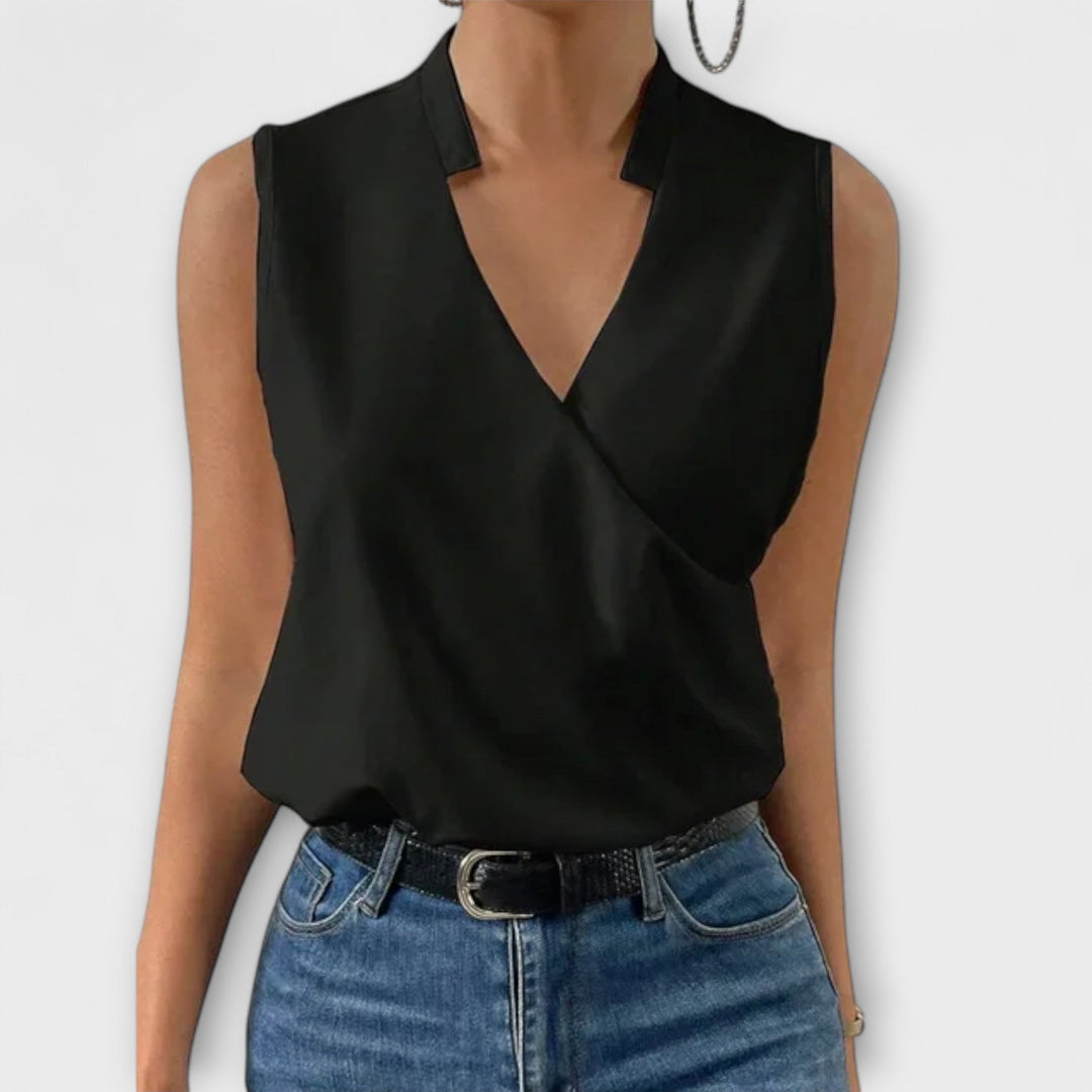 Nina wrap blouse in sky blue, styled with tailored trousers, front view