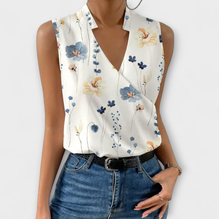 Flat lay of the Nina sleeveless wrap blouse showing available color options