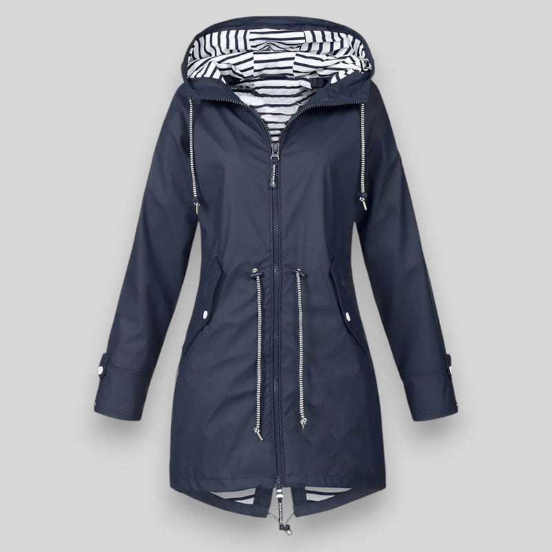 Woman wearing a sleek navy blue waterproof jacket with adjustable hood, styled for a rainy day