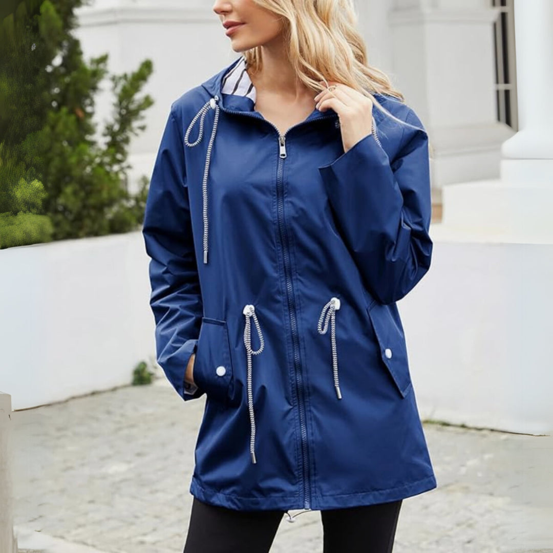 Detail shot of the adjustable hood on a sleek waterproof jacket in navy blue