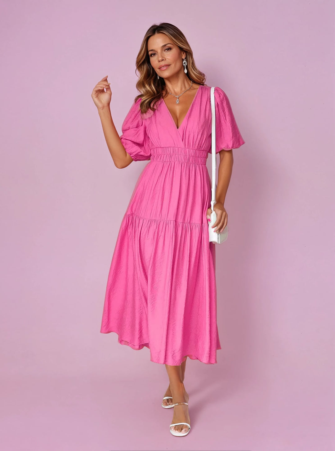 Noelle pink midi dress showing deep V-neckline and voluminous puff sleeves