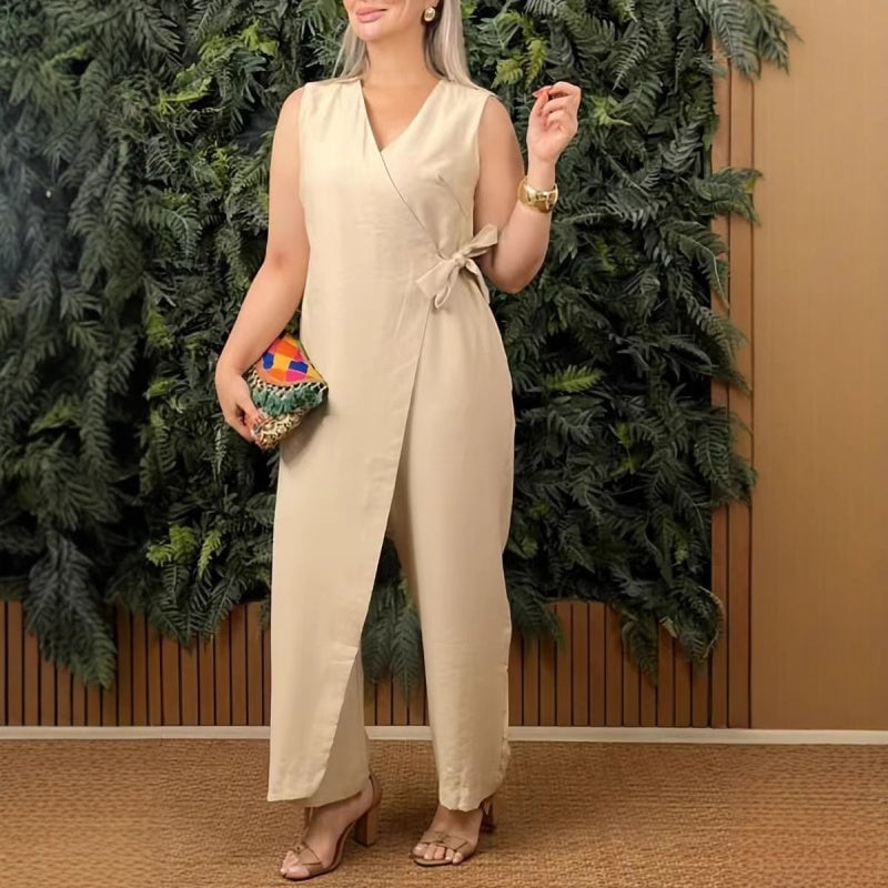 Front view of sleeveless wrap jumpsuit showing deep V-neckline and self-tie waist belt