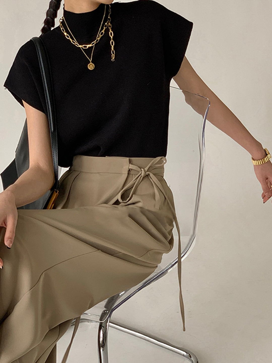 Noira sleeveless knit top in khaki, back view on model