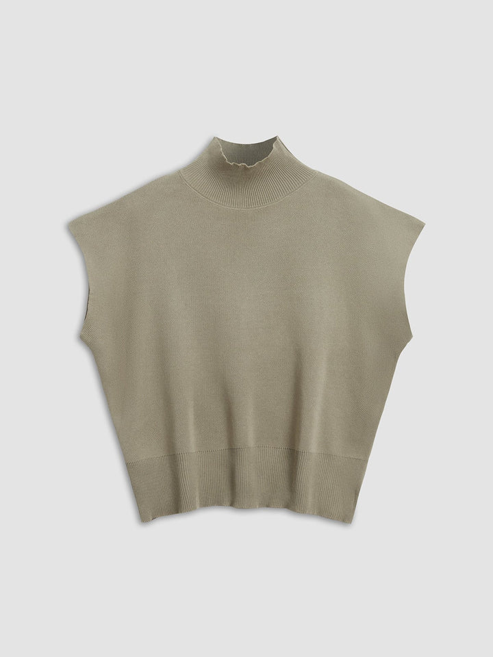 Back view of the Noira mock neck knit top in off-white